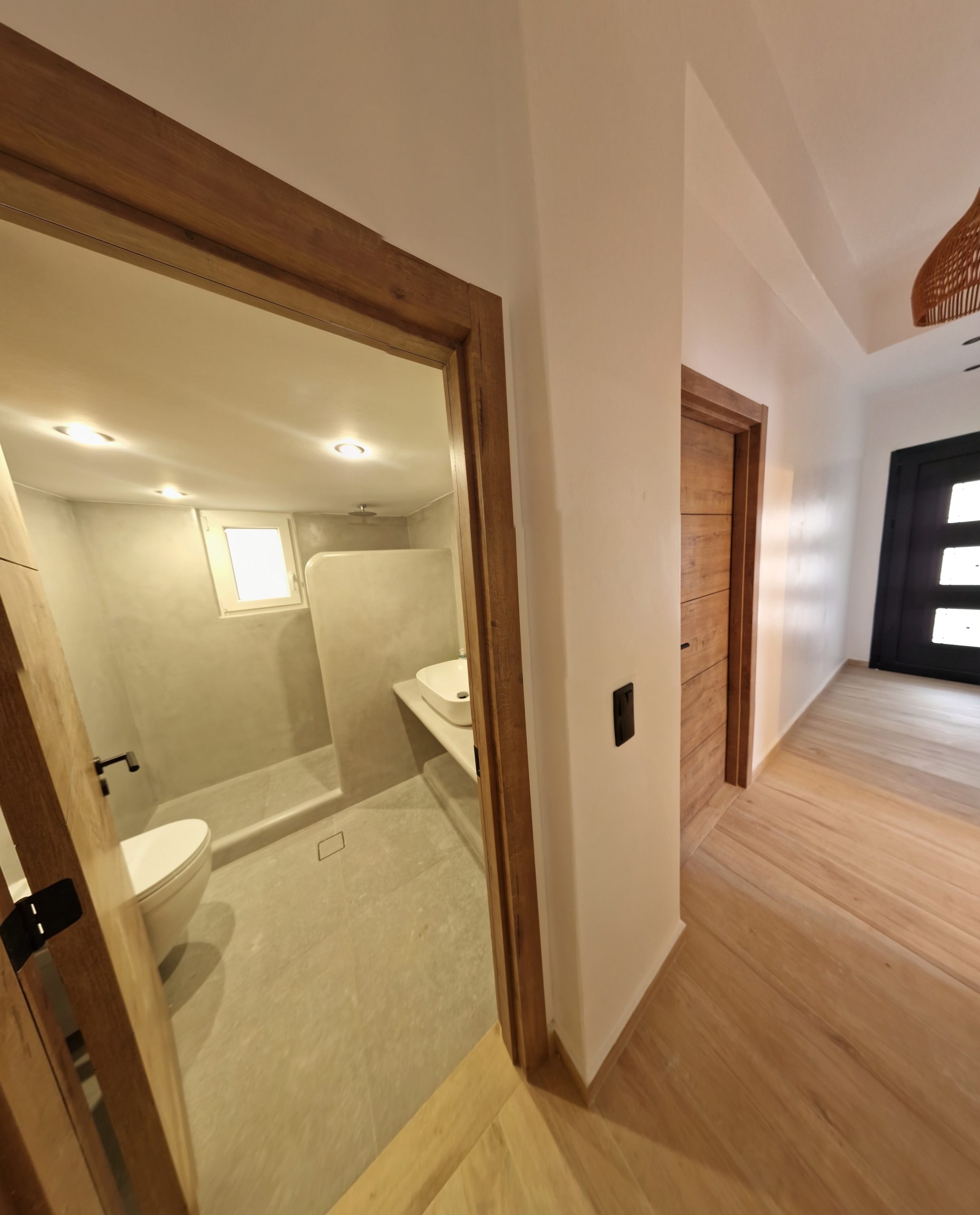 Actual Alya Paros interior passage and bathroom finishes